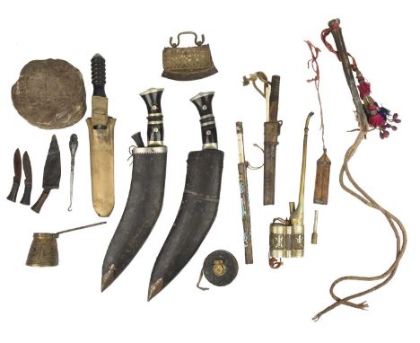 A quantity of Eastern edged weapons and associated items, including: two Kukri, polished horn and white metal mounted hilts, 