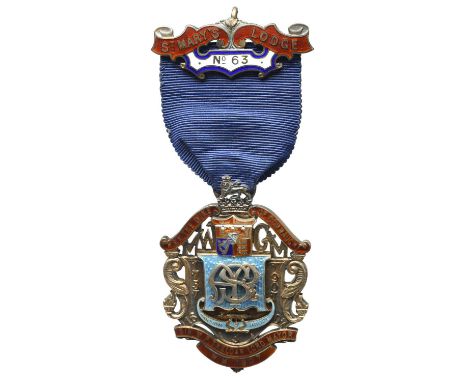 Freemasonry: an Edwardian Anniversary Jewel of No 63 St Mary's Lodge, gilt and enamel, 41mm wide, of openwork cartouch form, 