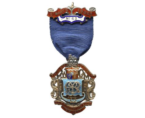 Freemasonry: an Edwardian Anniversary Jewel of No 63 St Mary's Lodge, gilt and enamel, 41mm wide, of openwork cartouch form, 