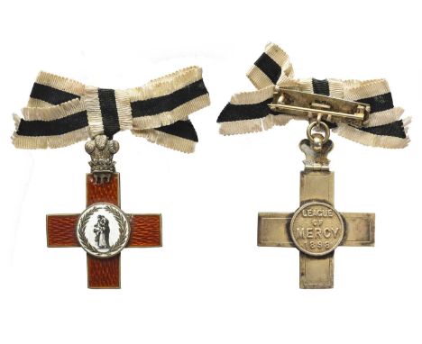 The Order of the League of Mercy: a lady's shoulder badge, silver-gilt and enamel, with bow ribbon, very fine or better.Width