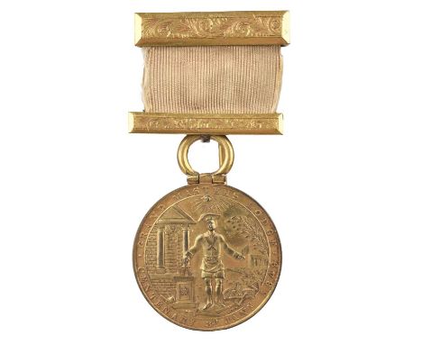 Irish Freemasonry: a Grand Master's Lodge Centenary Jewel, gilt disc 36mm, a mason with his tools in a landscape with an arch