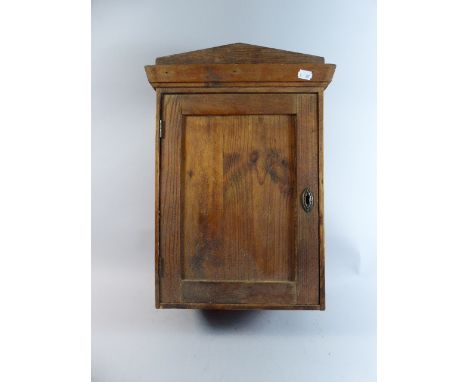 A Late 19th Century Stained Pine Wall Hanging Cabinet with Panel Door, 49cm high  