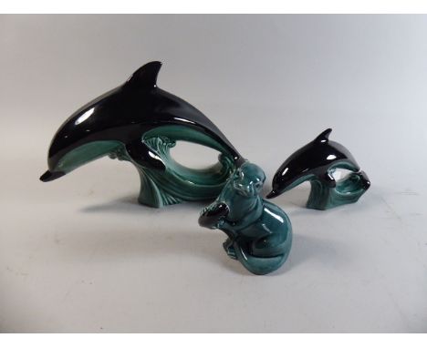 Two Graduated Poole Dolphins and Seated Seal with Fish 