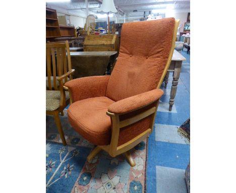 An Ercol Swivel Armchair 
