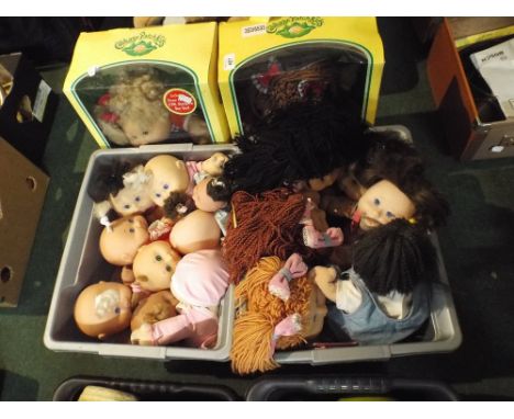 A Large Collection of Boxed and Unboxed Cabbage Patch Kid Dolls