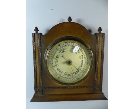 An Edwardian Brass Mounted Wall Mounted Aneroid Barometer of Architectural Form, 30cm Wide 