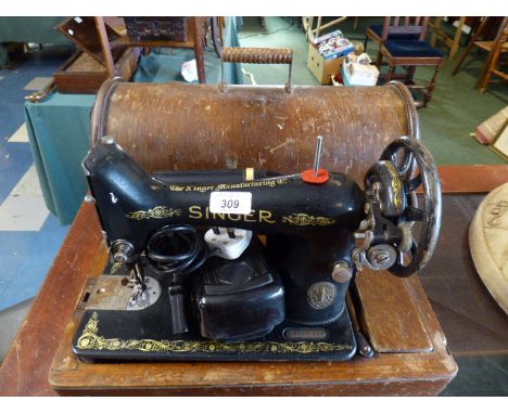 A Vintage Electric Singer Sewing Machine 