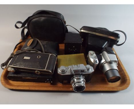 A Tray Containing Nine Vintage Cameras