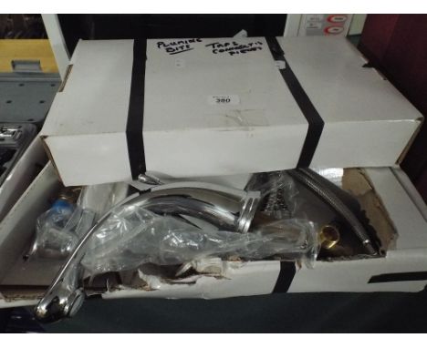 A Set of New Unused Mixer and Wash Basin Taps Together with Plumbing Connections 