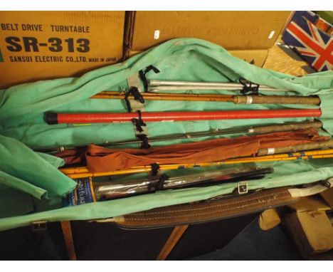 A Canvas Roll Containing Vintage Split Cane and other Fishing Rods  