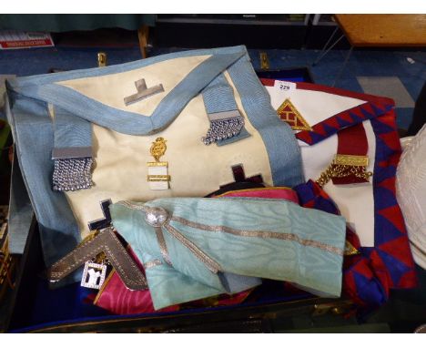 A Small Vintage Suitcase Containing Masonic Regalia to Include Sashes, Aprons, Jewels Etc