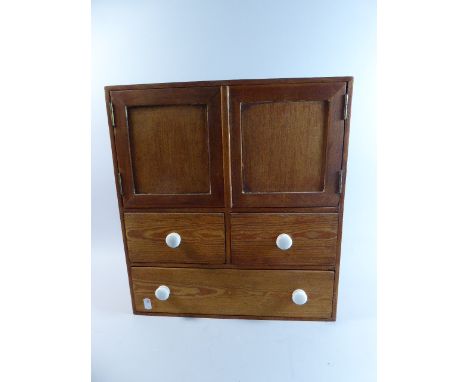 A Late 19th Century Wall Hanging Pine Spice or Kitchen Cabinet with Cupboard Top, Two Small and One Long Drawers, All with Ce