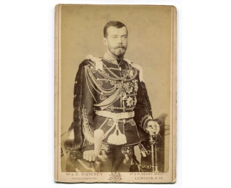 PHOTOGRAPHS. A collection of cartes-de-visite and cabinet-size photographs in an album and loose, the majority portraits and 