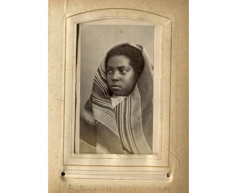 PHOTOGRAPHS. A leather-bound album containing 19 cartes-de-visite size mounted albumen-print portrait photographs of ethnogra