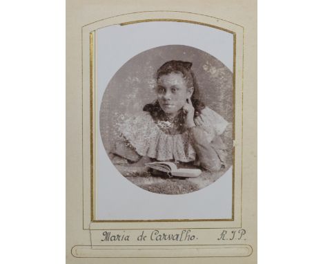 PHOTOGRAPHS. A leather-bound album containing approximately 77 cartes-de-visite and cabinet-size portrait photographs.Buyer’s