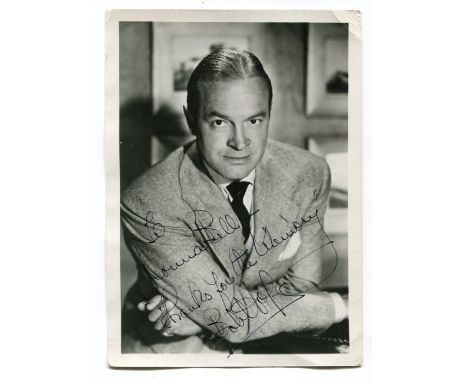 EPHEMERA, CELEBRITY. A black and white portrait photograph of Bob Hope signed in black ink, 126 x 178mm., together with a 'Br