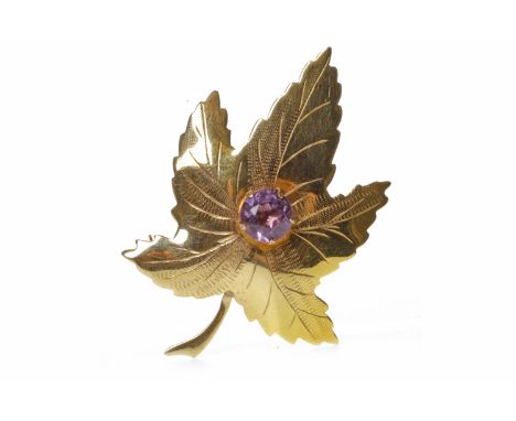 NINE CARAT GOLD MAPLE LEAF MOTIF BROOCHset with a central round amethyst, 45mm long, with full Birmingham hallmarks, 3.8g