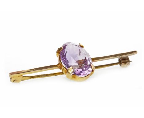 AMETHYST BAR BROOCHset with a single oval amethyst 9mm long, on a bar 44mm long, unmarked