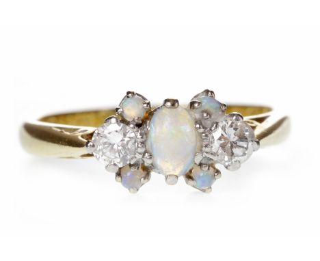 EIGHTEEN CARAT GOLD OPAL AND DIAMOND DRESS RINGset with a central oval opal 5mm long and flanked by two round brilliant cut d