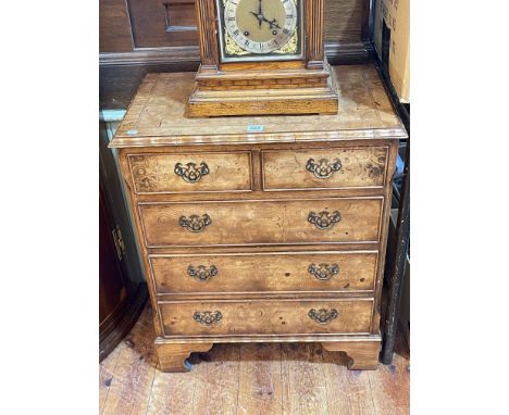 Small walnut chest of two short above three long drawers on bracket feet, 37cm by 60cm by 72cm.
