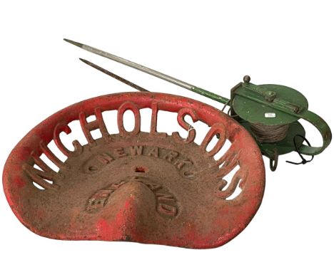 Vintage tractor seat marked Nicholsons Newark and vintage boundary marker.