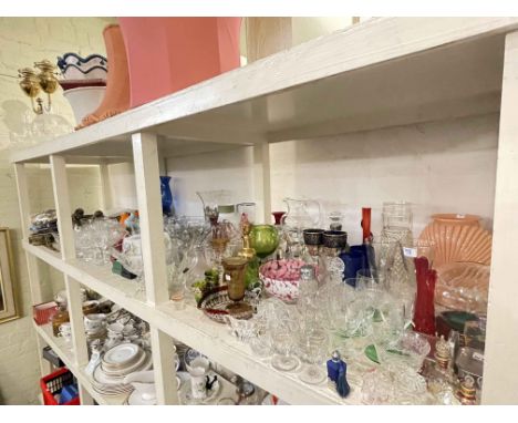 Full shelf of coloured and clear glassware, cutlery, EP, etc.