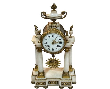 Ornate gilt and alabaster mantel clock with finial, 42cm.