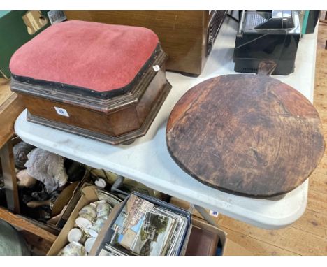 Rustic hardwood bread board on four feet and a mahogany box stool.