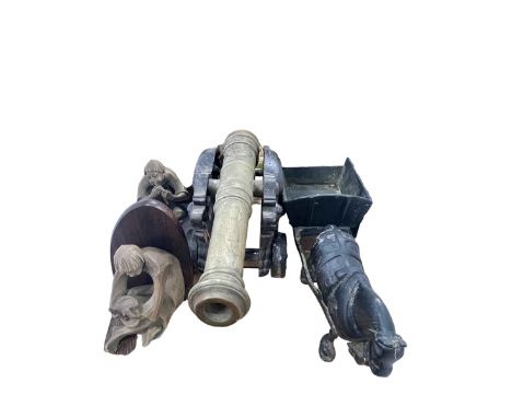 Brass cannon, cast iron fire dogs, figural bookends, brass table lamp, etc.