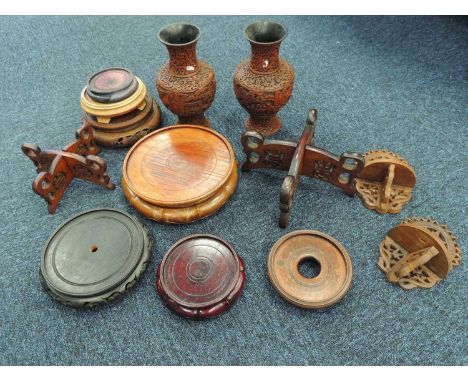 ORIENTAL COLLECTABLES including pair of Chinese Cinnabar type vases, 23.5cms (h), various hardwood plated and vase standsProv