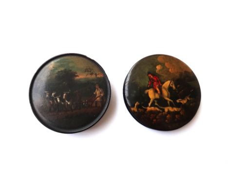 A Stobwasser type circular papier mache snuff box and cover, 19th century, depicting a farmer and four cows ploughing a field
