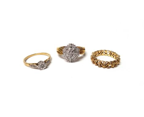 A 9ct gold and diamond set oval cluster ring, mounted with circular cut and baguette diamonds, a 14ct gold and diamond set fu