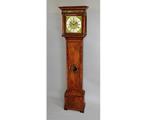 A Queen Anne walnut longcase clockThe movement by Charles Gretton, LondonThe case with a moulded pediment above a pierced fri