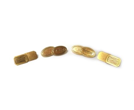 A pair of 9ct gold oval cufflinks, each initial engraved to one side and plain to the other, otherwise with engine turned bor