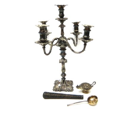 A silver table lighter, formed as an oil lamp, with a serpentine handle, Chester 1934, a silver toddy ladle, the bowl mounted