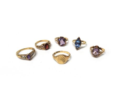 Seven various 9ct gold and gem set rings, to include; an amethyst single stone ring, ring size M, a signet ring with radiatin