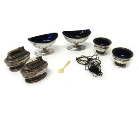 A pair of George III silver boat shaped salts, of oval form, with partly fluted decoration, London 1800, with blue glass line