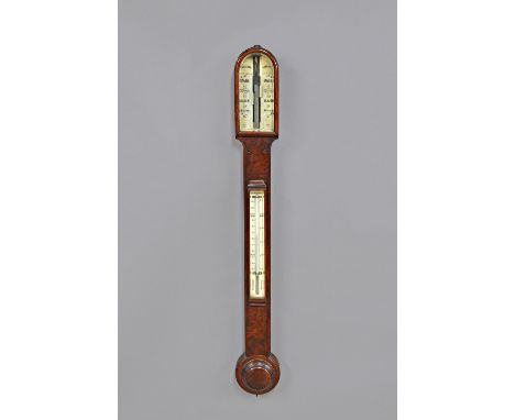 A Victorian walnut stick barometerBy Dollond, LondonThe trunk with an arched top, above signed and engraved ivory dials, with