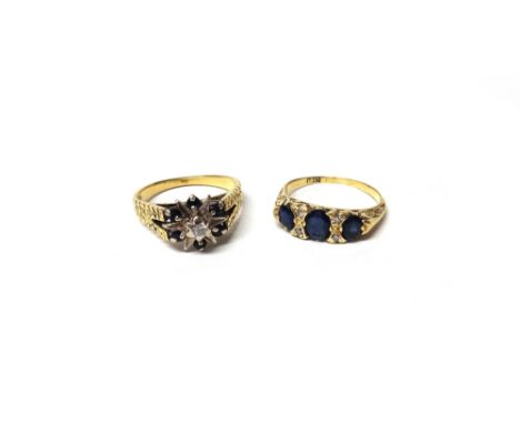 A gold ring, mounted with three oval cut sapphires and with two pairs of circular cut diamonds, mounted at intervals, the mou