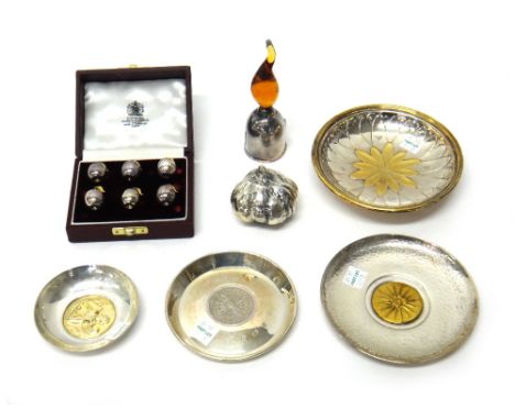 A silver and gilt circular dish, with a flowerhead motif at the centre, diameter 13cm, a silver circular dish, mounted with a