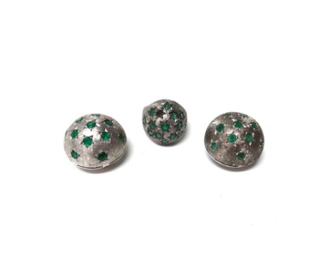 An emerald set bombe cluster ring, star set with circular cut emeralds, (one emerald lacking), detailed 18 K, ring size K and