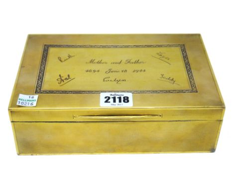 A silver gilt rectangular table cigarette box, the top presentation inscribed, otherwise engine turned, size 20cm x 13.5cm x 
