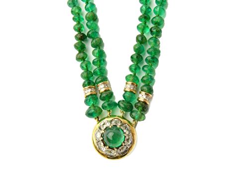 A gold mounted emerald and diamond bracelet, by Tambetti, formed as four rows of emerald beads, with eight diamond set divisi