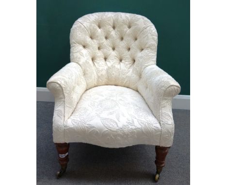 A Victorian spoon back easy armchair with serpentine seat on turned mahogany supports, 75cm wide x 90cm high. 