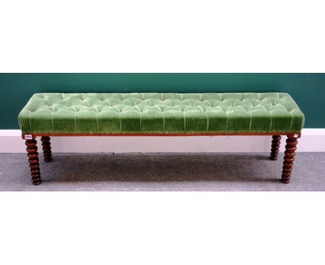A 19th century walnut framed long rectangular stool, on tapering bobbin turned supports, 135cm wide x 37cm deep.