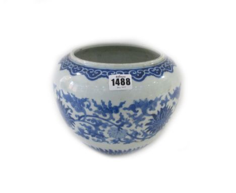 A Chinese blue and white jardiniere, late 19th century, painted in Kangxi style with lotus meander beneath a ruyi head border