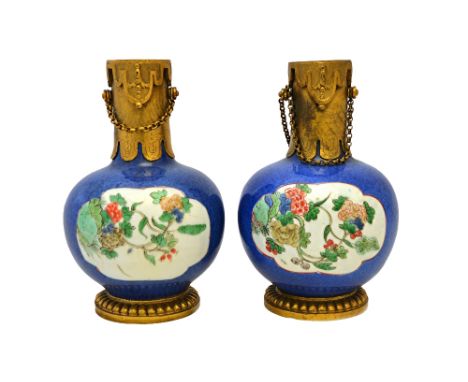 A pair of Chinese gilt-metal mounted famille-verte bottles, the porcelain Kangxi, the mounts 18th/early 19th century, each pa