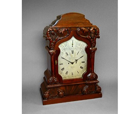 A Victorian mahogany bracket clockBy James McCabe, London, No. 2112The arched case of shaped outline, with foliage and vine-c