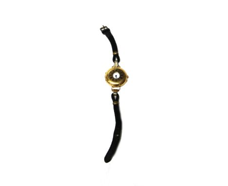 A gold cased half hunting cased wristwatch, with a gilt jewelled lever movement, the inner and outer cases detailed 18 K, the
