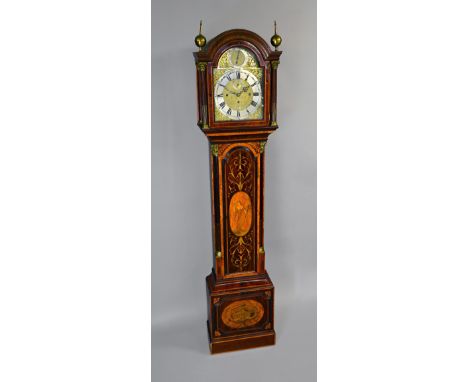 An Edwardian mahogany, satinwood and marquetry inlaid quarter chiming triple train longcase clockThe case with an arched pedi